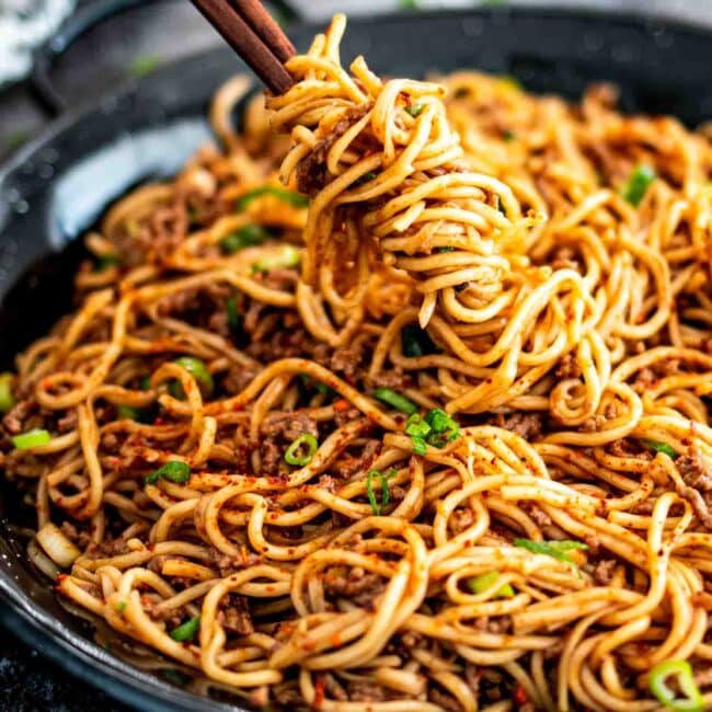 freshly made asian ground beef noodles in a skillet.