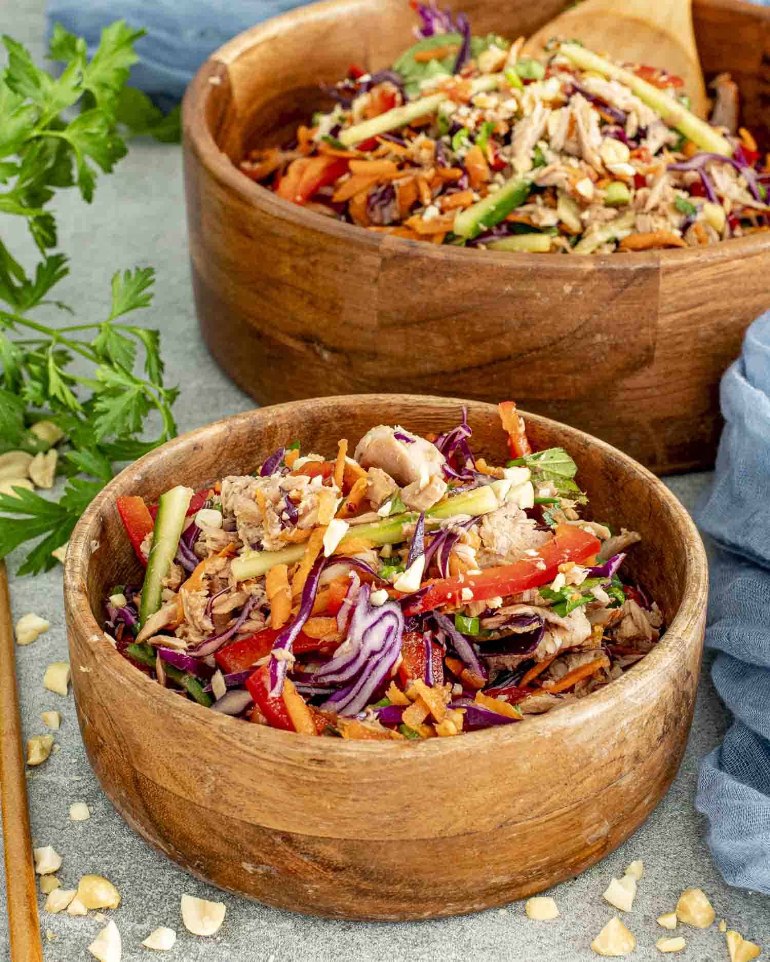 a serving of fresh asian tuna salad in a wooden bowl.