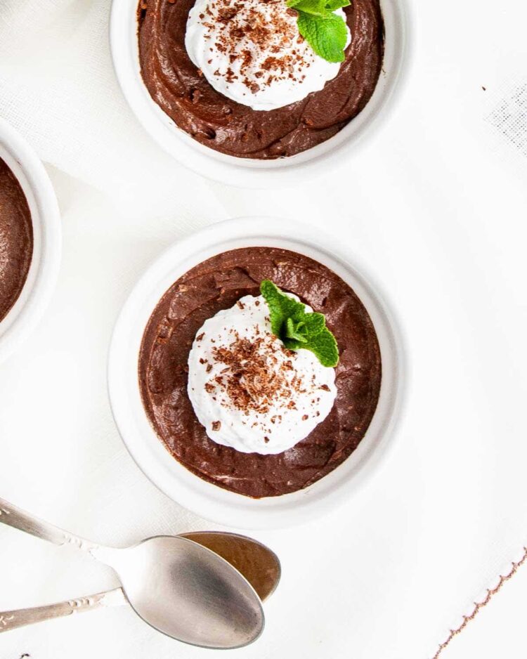 overhead shot of avocado chocolate mousse in white ramekins