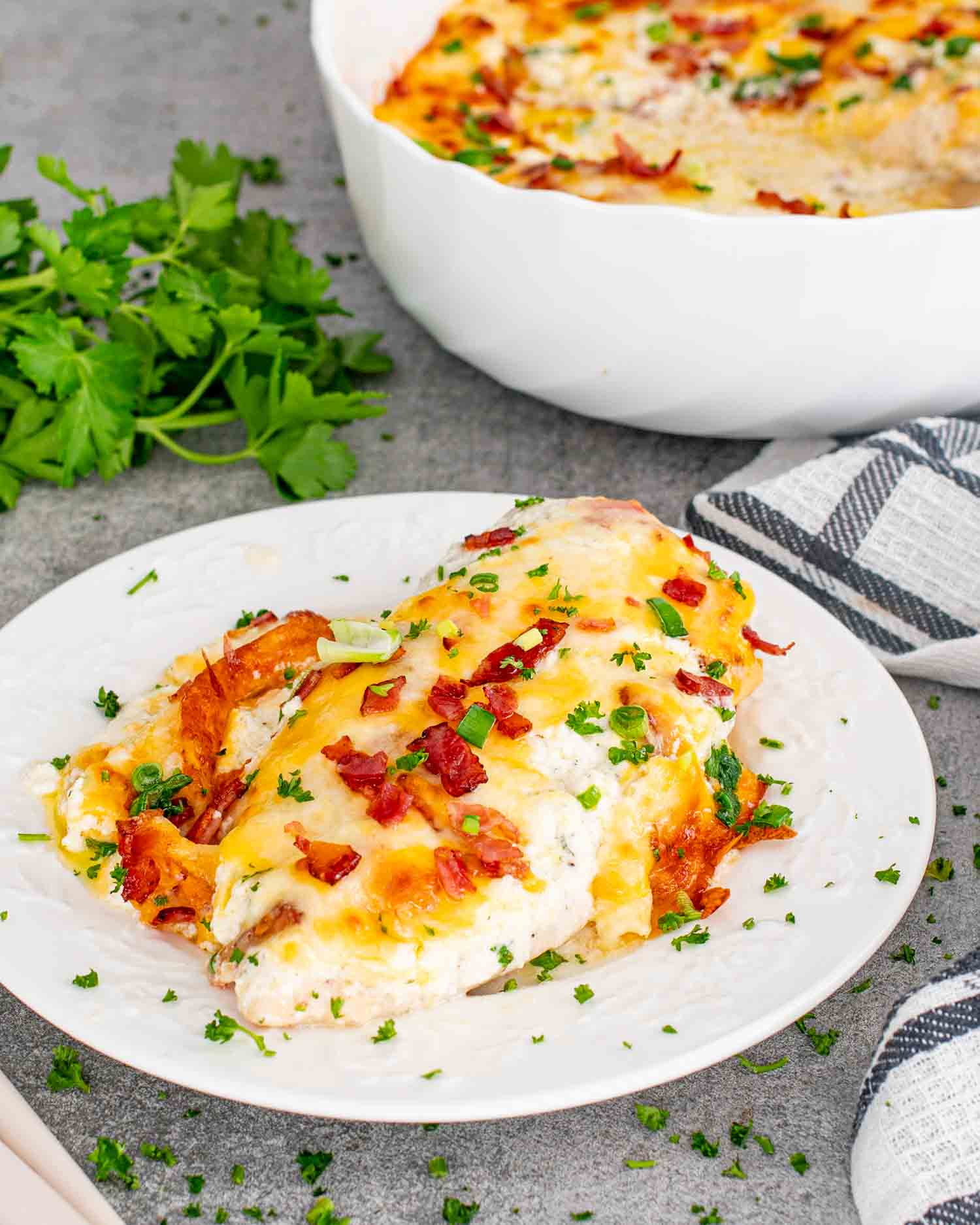 a serving of baked crack chicken on a white plate.