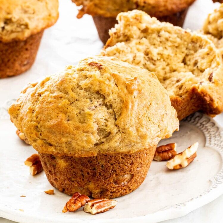 Fluffy banana nut muffins packed with chopped pecans, golden tops, and soft, moist centers—perfect for breakfast or snacking.
