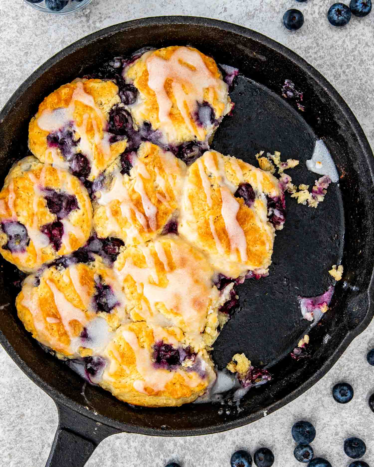 freshly baked blueberry biscuits in a black cast iron skillet.