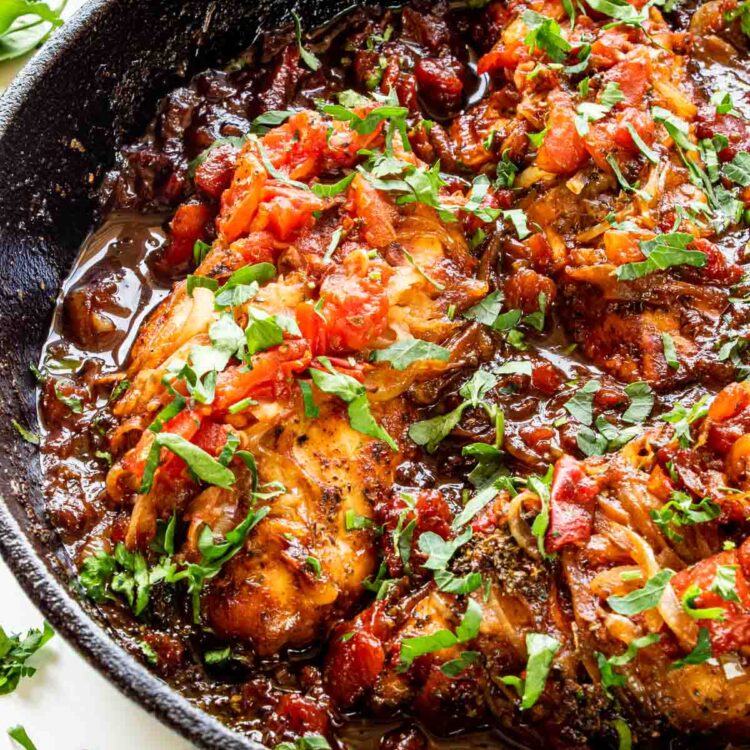 freshly made braised balsamic chicken in a skillet.