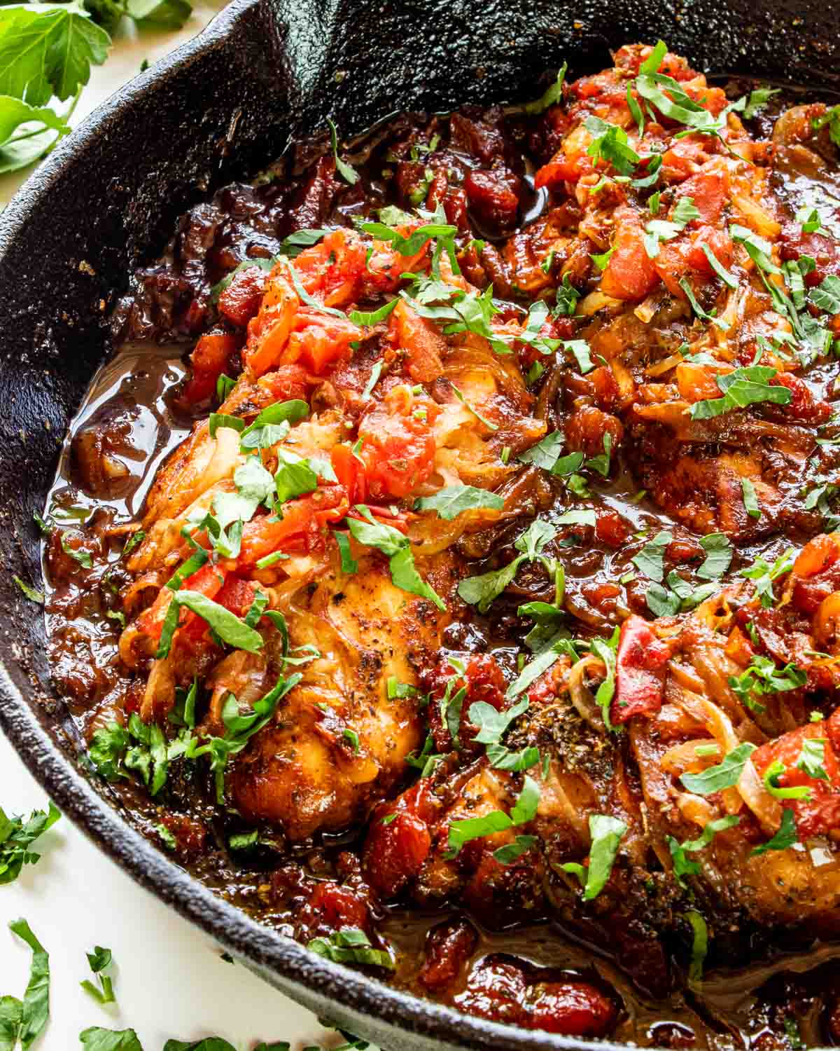 freshly made braised balsamic chicken in a skillet.