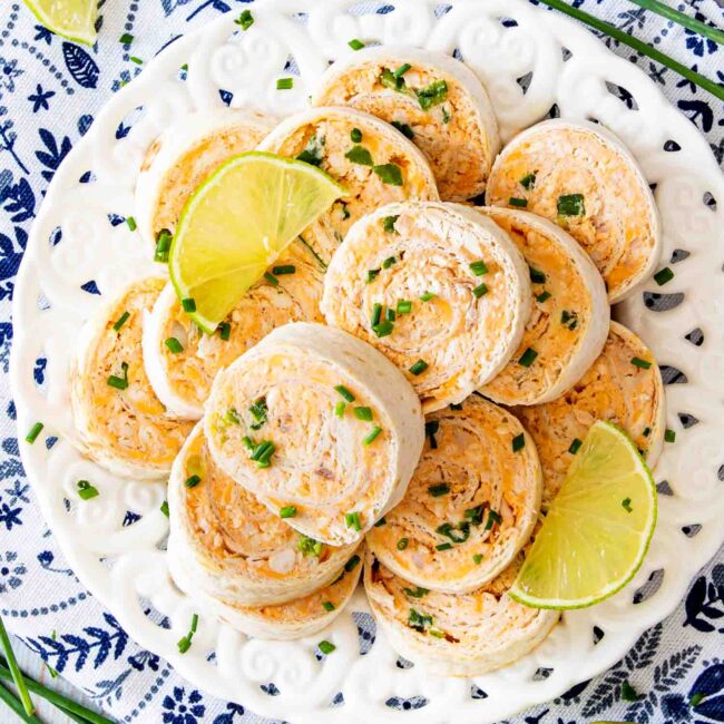 buffalo chicken pinwheels on a white platter.