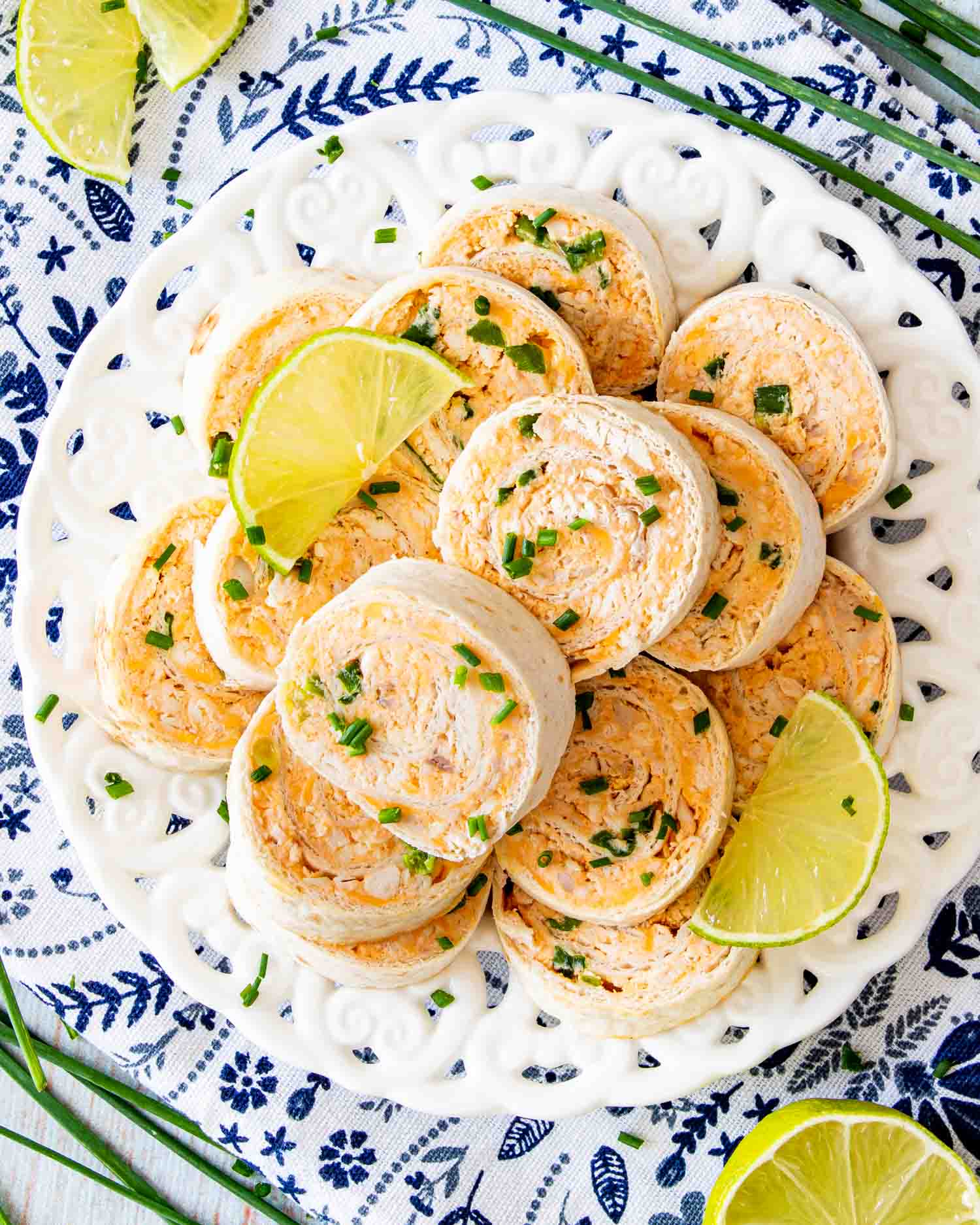 buffalo chicken pinwheels on a white platter.