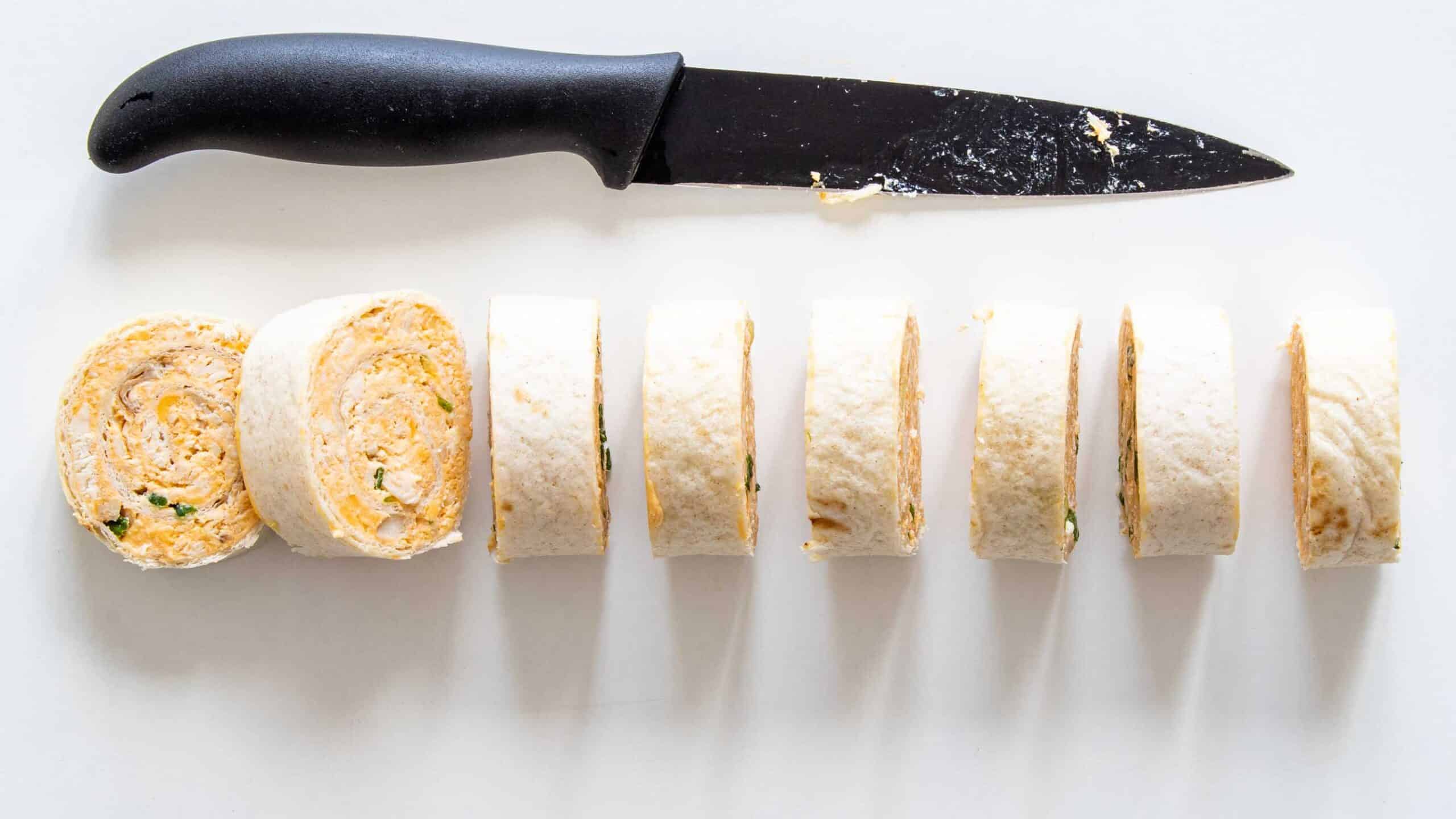 process shots showing how to cut buffalo chicken pinwheels.