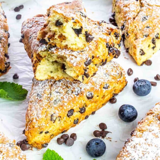 chocolate chips scone with another one broken in half.