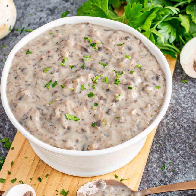 condensed cream of mushroom soup in a white serving bowl.