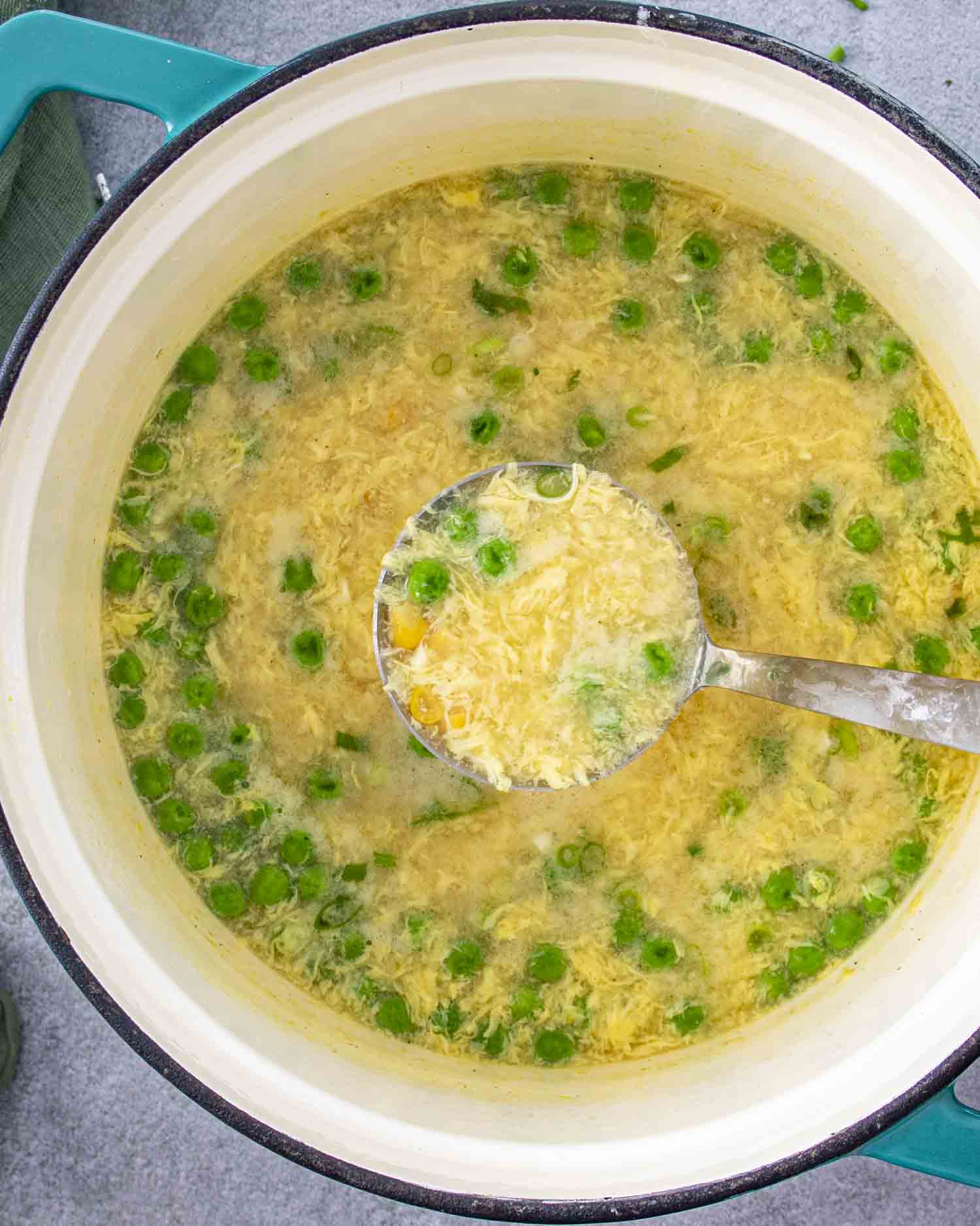 freshly made egg drop soup in a dutch oven.