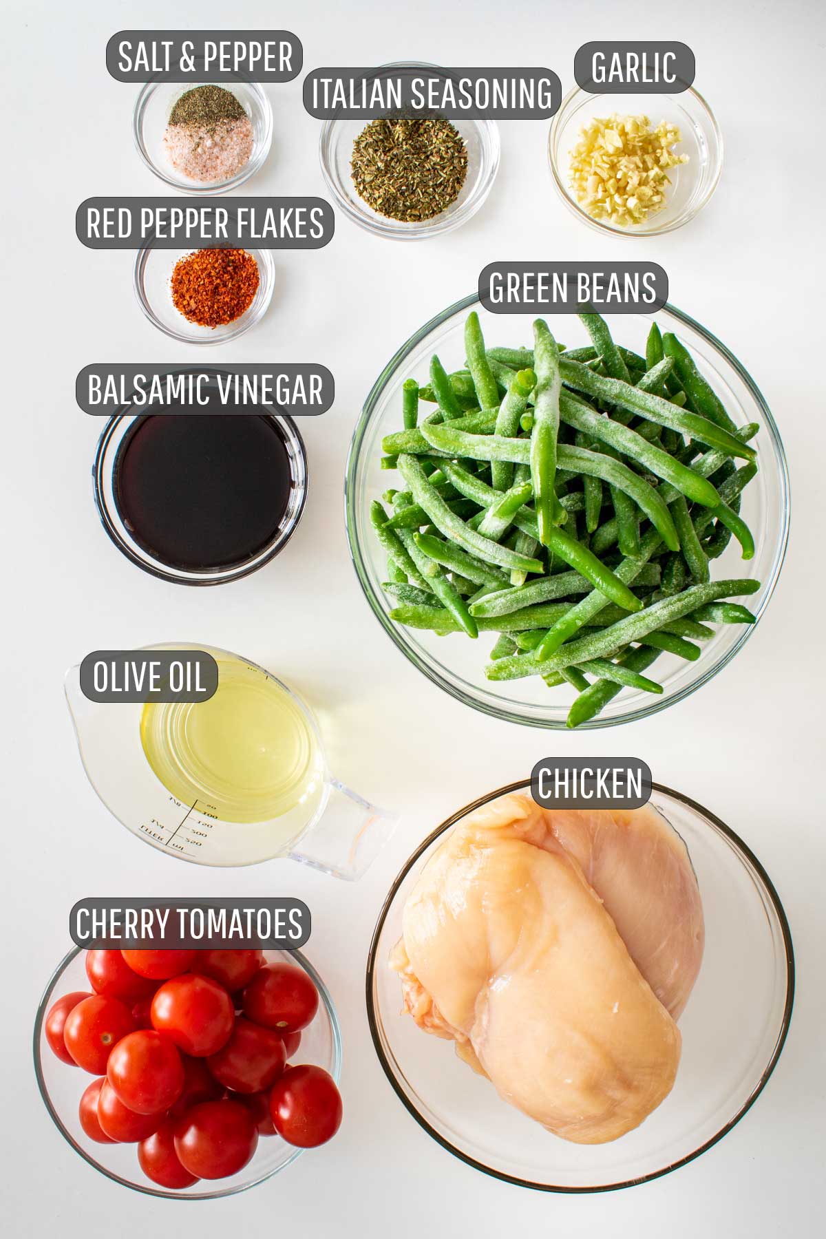 overhead shot of ingredients needed to make italian chicken sheet pan dinner.
