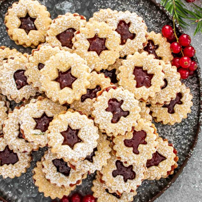a plate with linzer cookies.