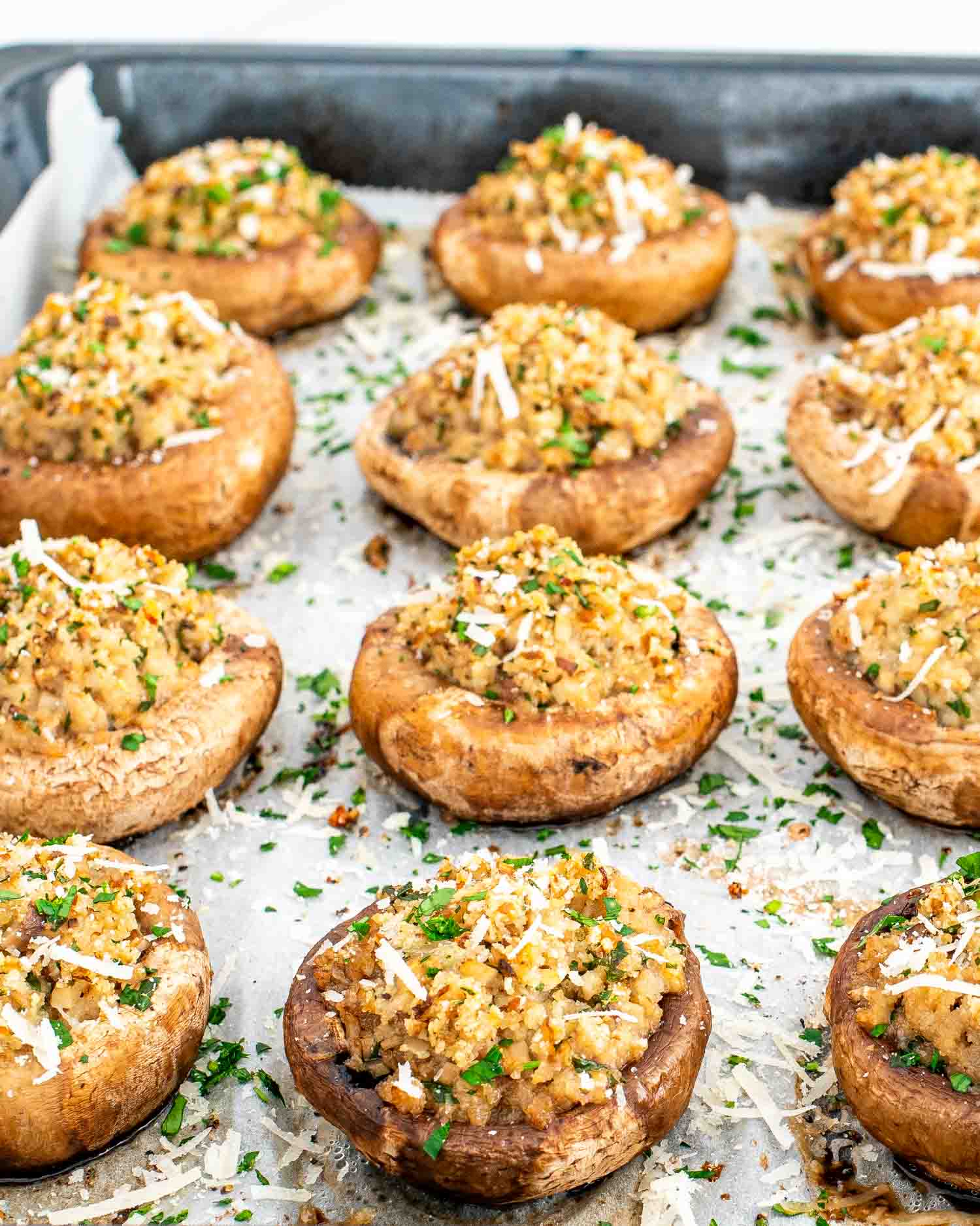 stuffed mushrooms fresh out of the oven on a baking sheet.