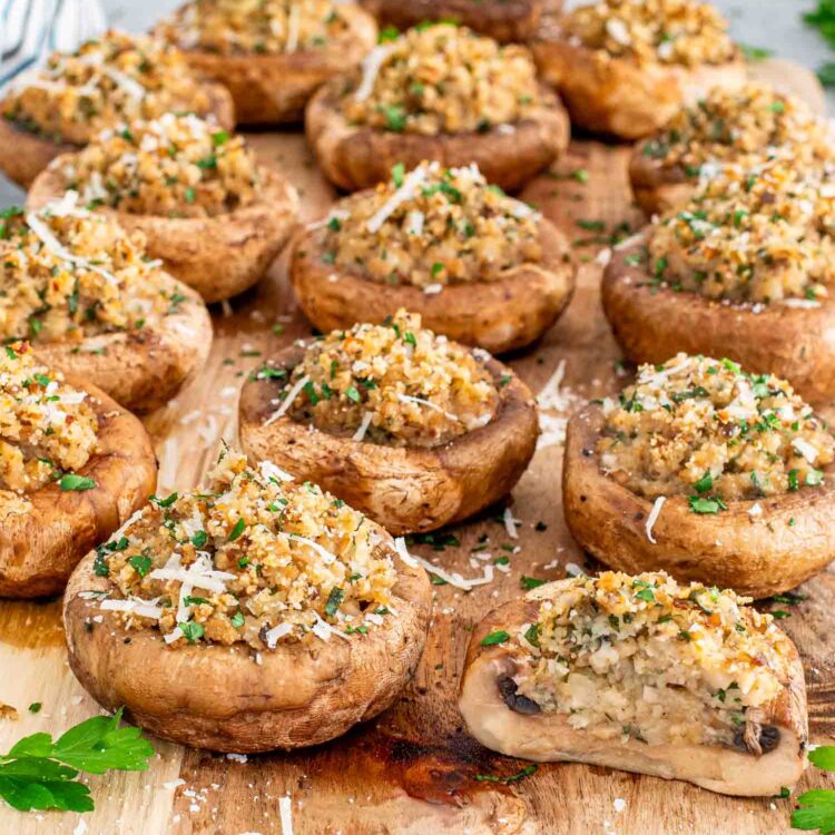 stuffed mushrooms on a cutting board.