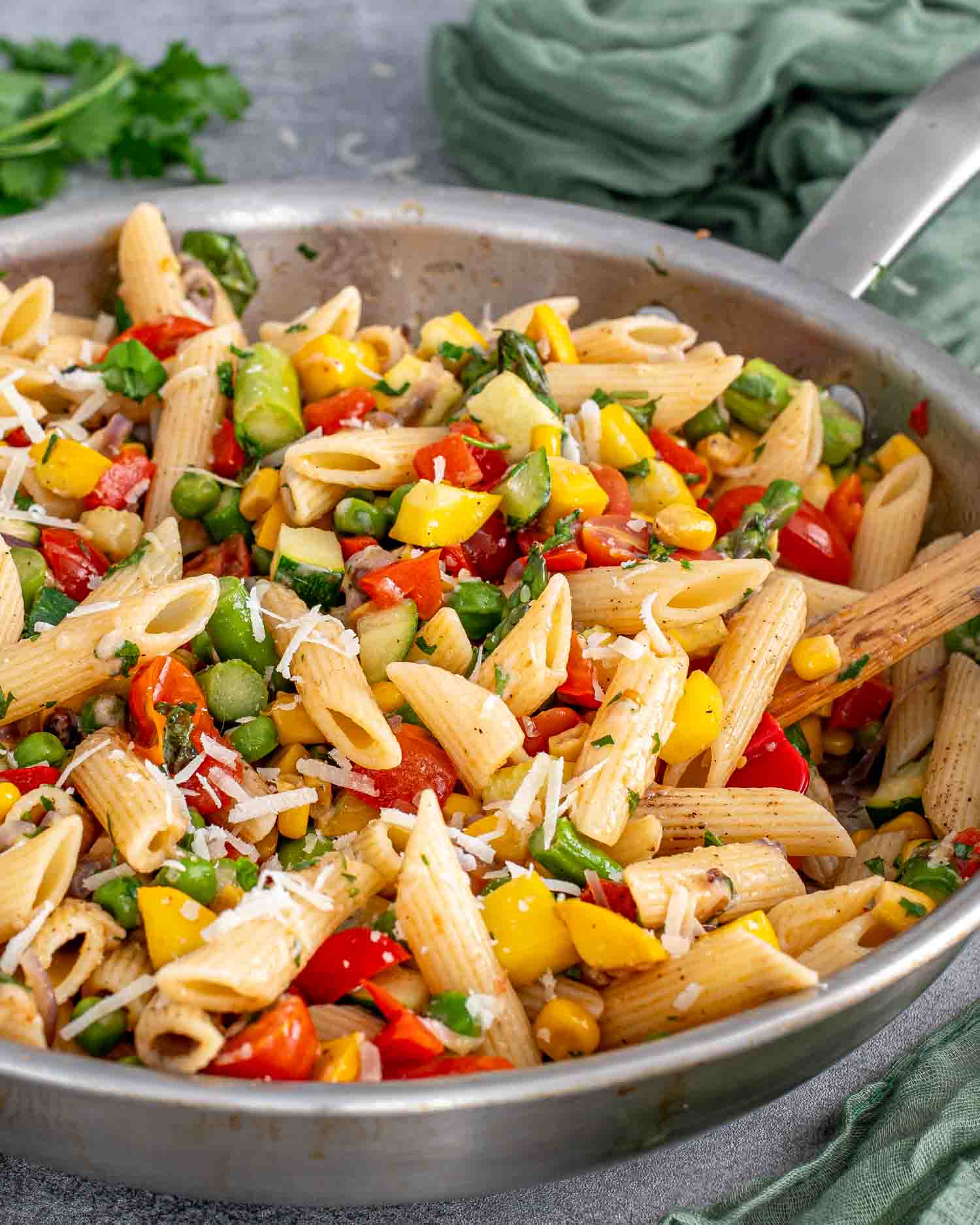 freshly made pasta primavera in a skillet.