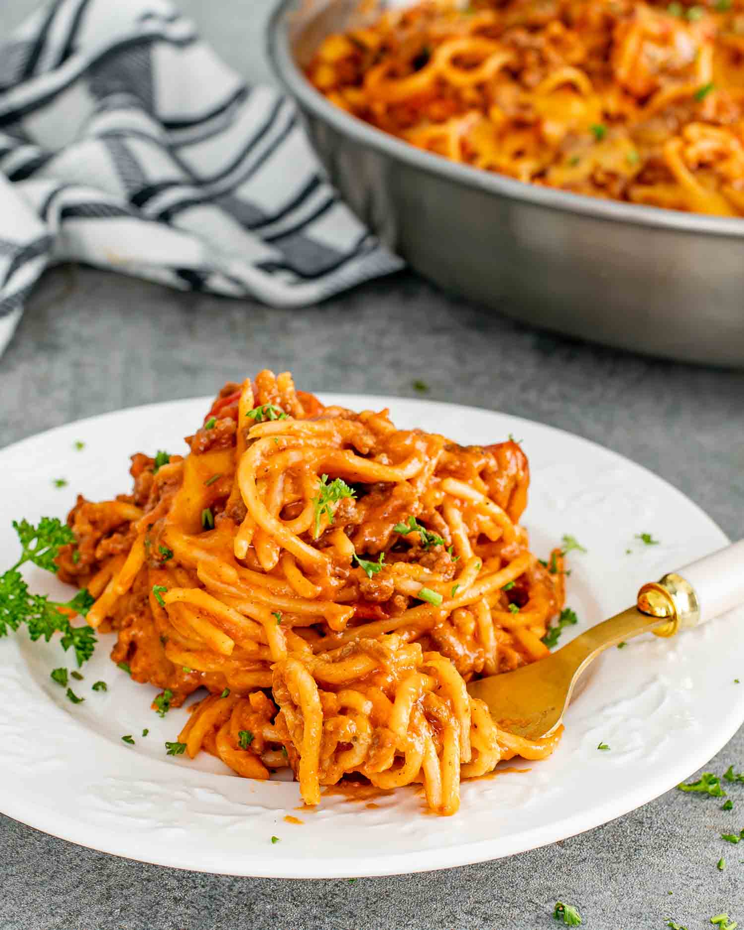 a serving of taco spaghetti on a white plate.