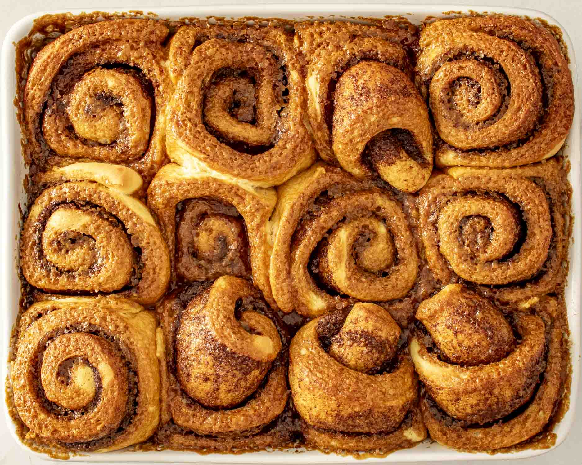 process shots showing how to make cinnamon rolls.