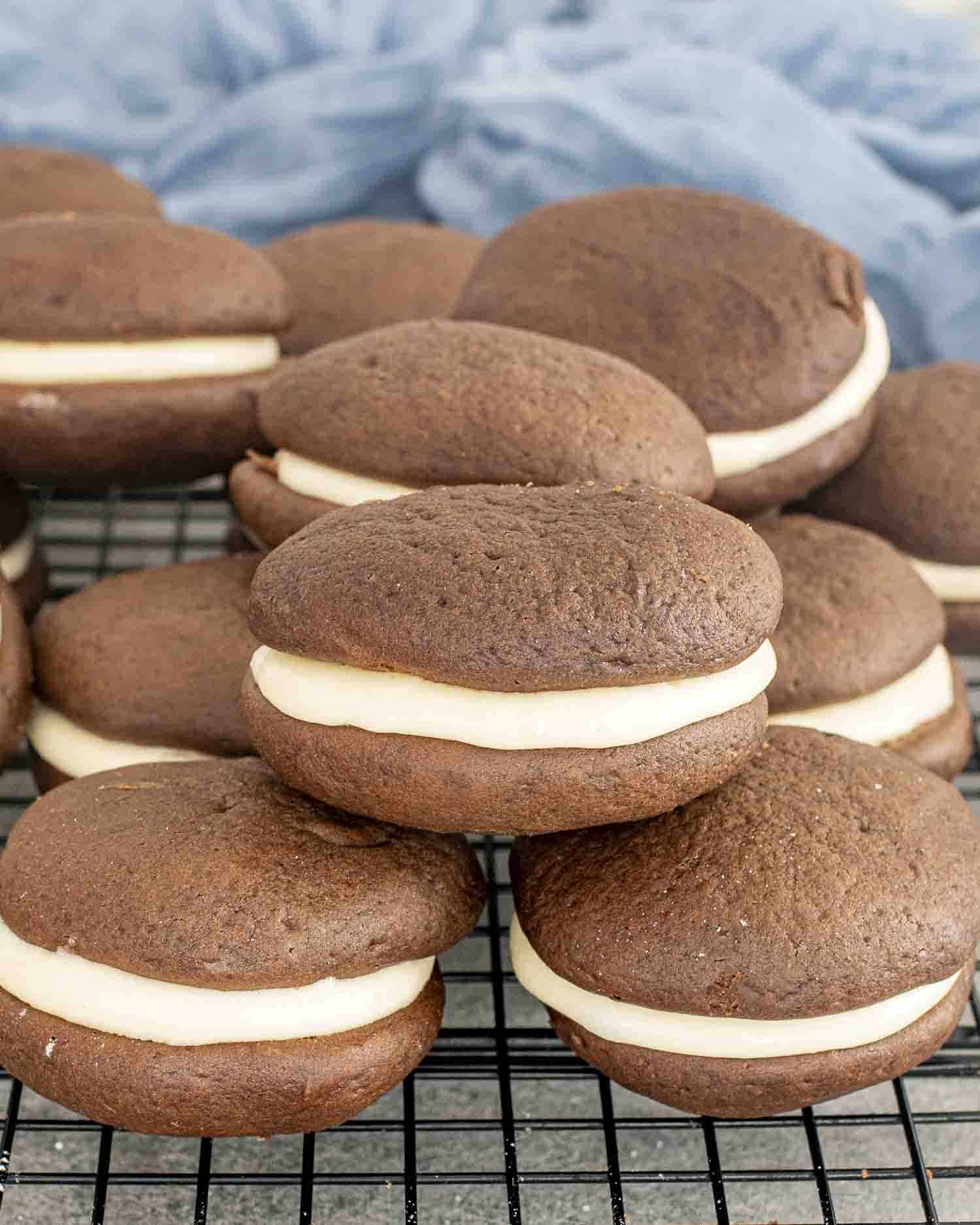 a few freshly made whoopie pies on a cooling rack.