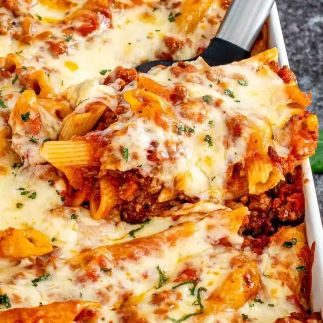 freshly baked mostaccioli in a white casserole dish.
