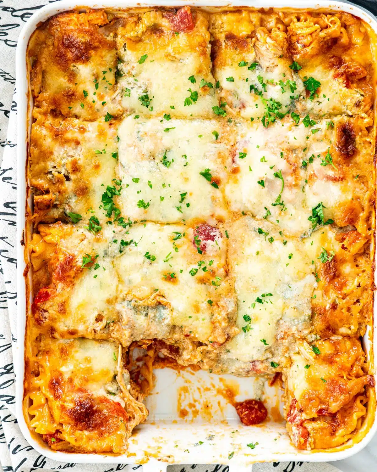 overhead shot of Buffalo Chicken Lasagna in a white casserole dish