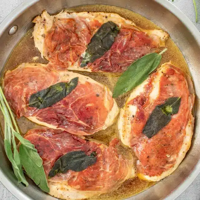 freshly made chicken saltimbocca in a skillet.