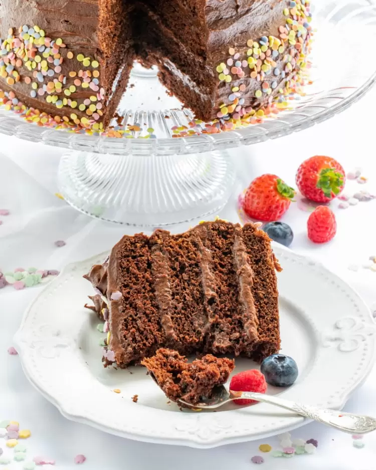 a slice of chocolate cake with a bite taken out of it