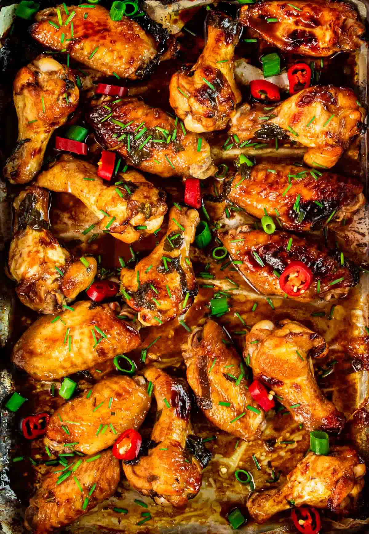 coca cola wings on a baking sheet fresh out of the oven.