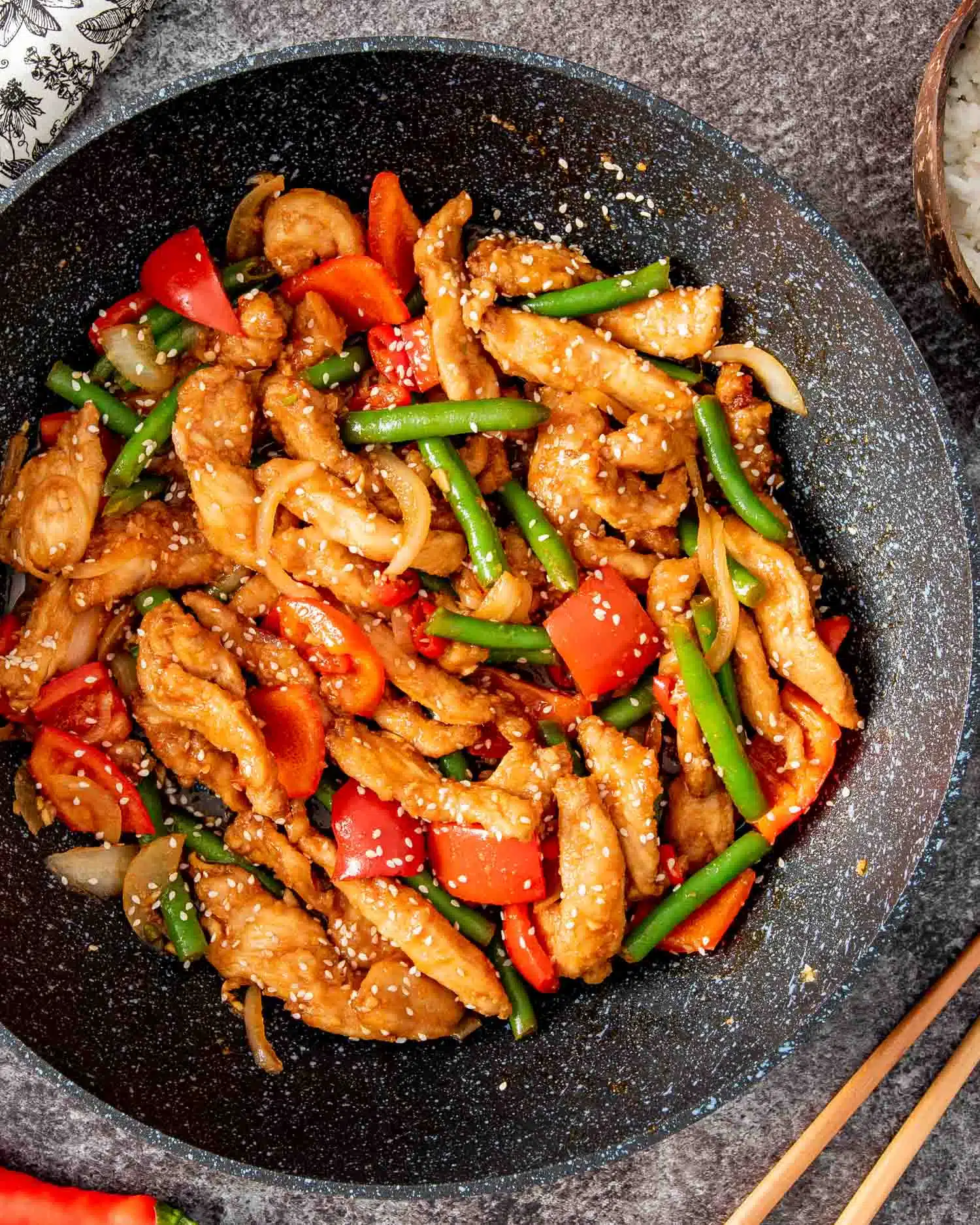 crispy honey chili chicken in a wok.