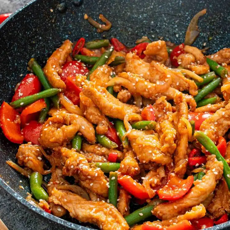 crispy honey chili chicken in a wok.