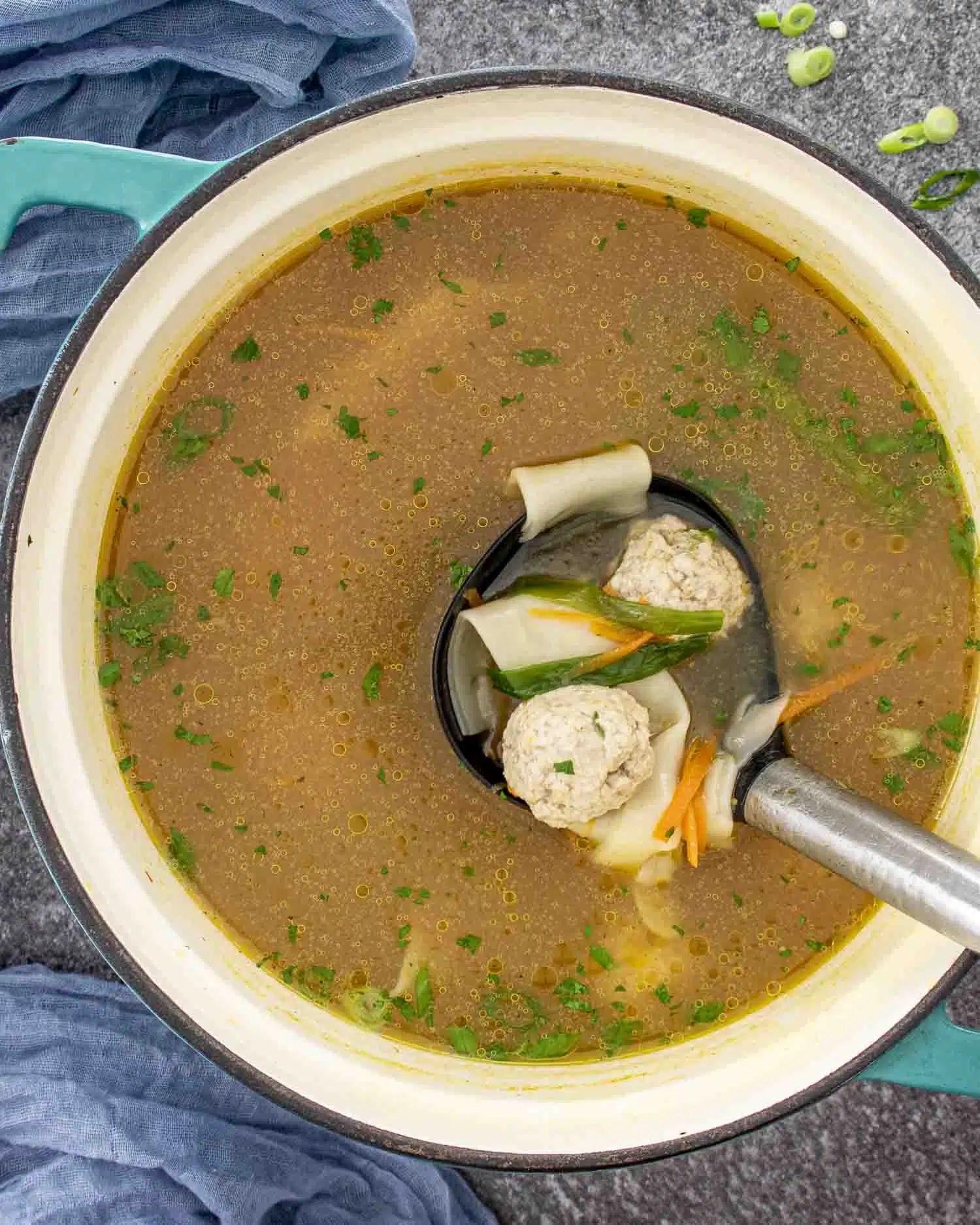 deconstructed wonton soup in a Dutch oven.