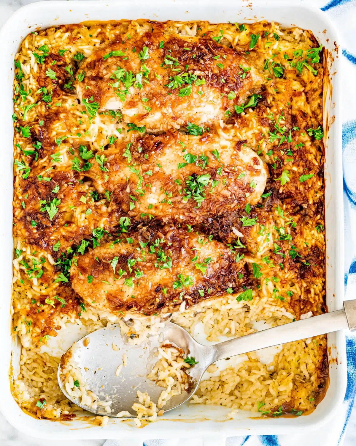 No Peek Chicken Rice Casserole in a white casserole dish