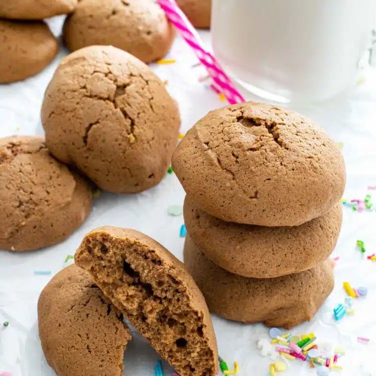 a few sour cream cookies on a white plate.