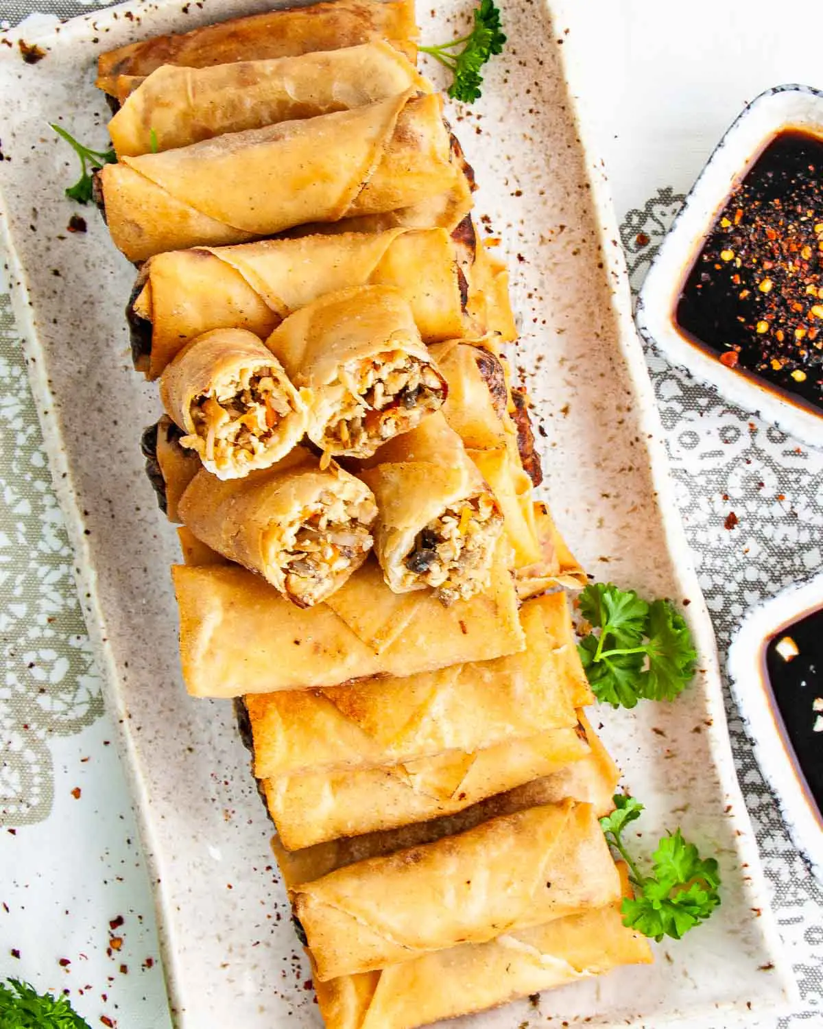 overhead shot of chicken egg rolls on a serving platter.
