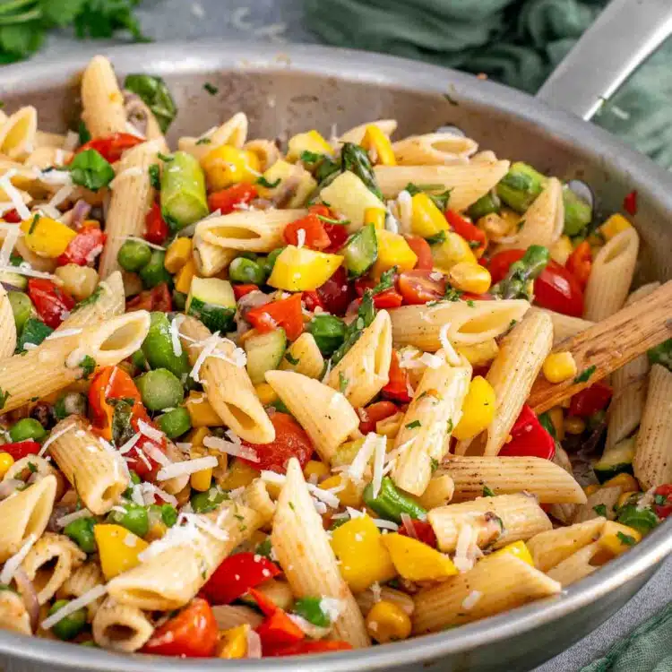 freshly made pasta primavera in a skillet.