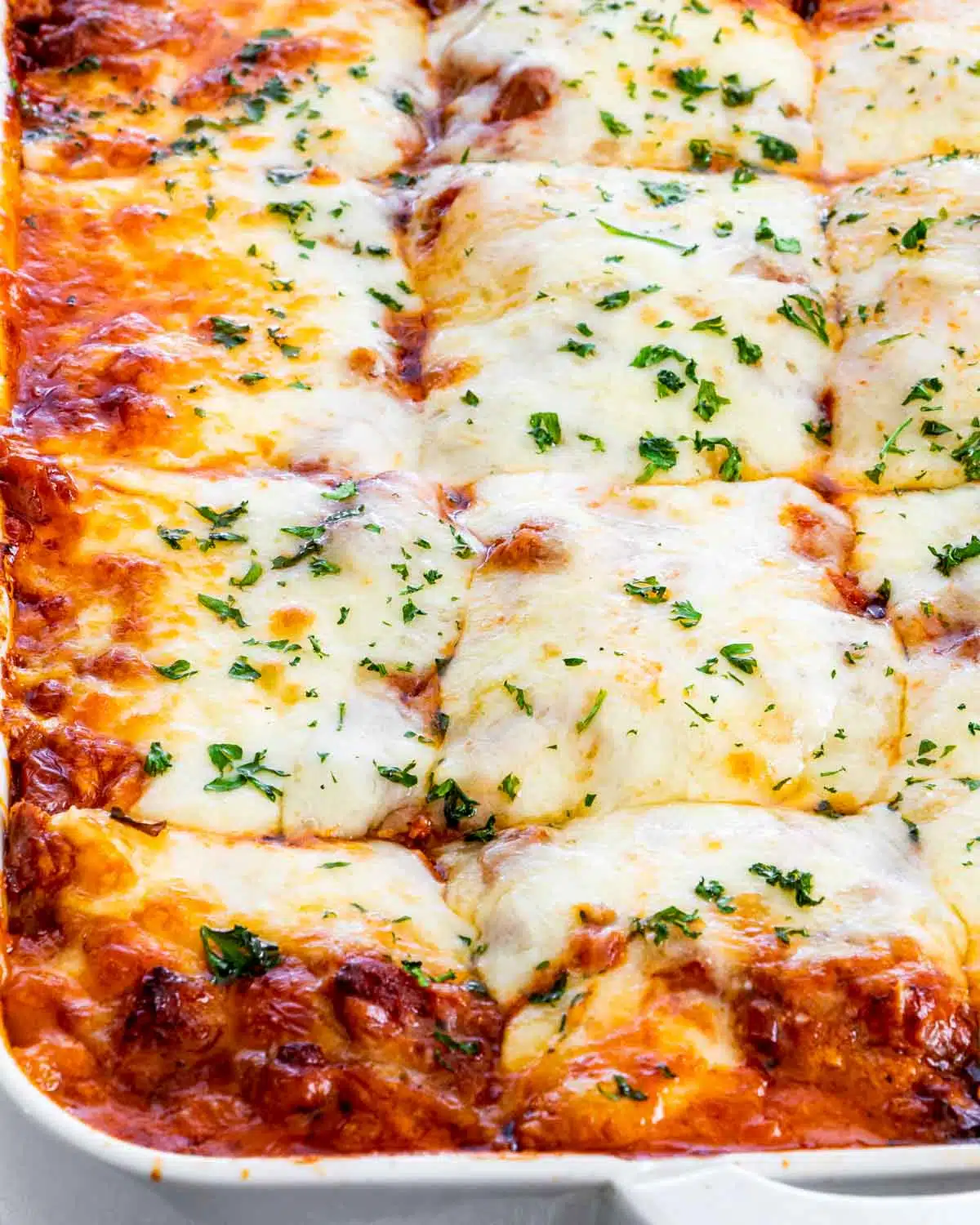 freshly baked lasagna in a casserole dish.